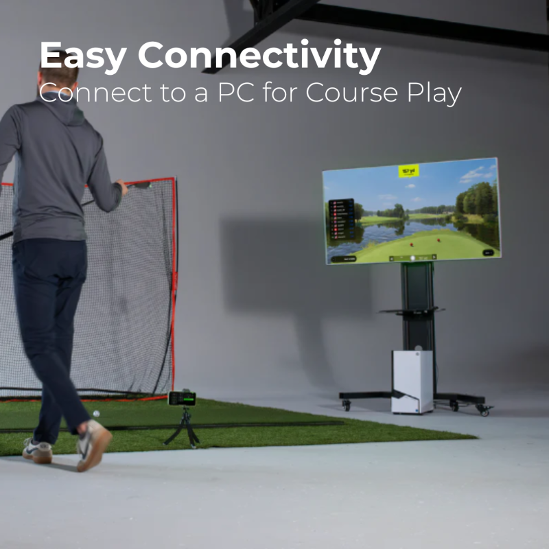 Golf simulator setup with a screen displaying a golf course and text about easy connectivity to a PC.