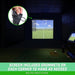 Golf simulator setup with screen displaying a golf course, surrounded by dark walls.