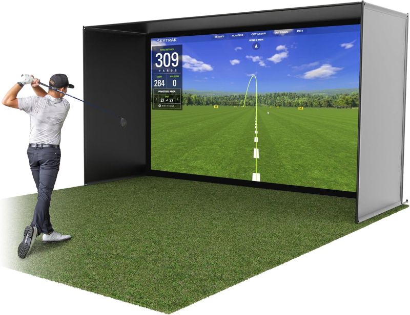 Golf simulator with a screen displaying a golf course and a person
