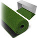 Roll of green artificial grass with a clear display box.