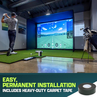 Indoor golf simulator setup with a screen displaying a golf course, surrounded by golf equipment and decor.