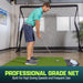 Man practicing golf swings in a home setting with a professional grade net.