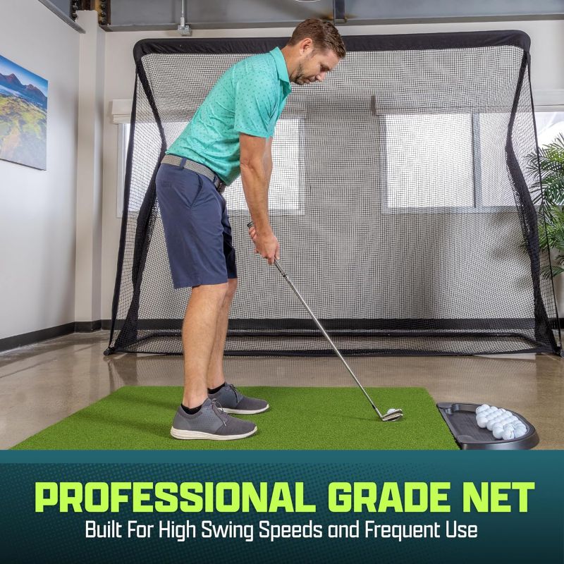 Man practicing golf swings in a home setting with a professional grade net.