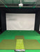 Pure Flight Hitting Mat shown in a golf simulator room