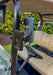 Phone and launch monitor mounted on a golf cart with a green background