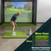Man practicing golf swings in a simulator with a focus on the mat's thickness and foam quality.