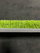 Close-up of artificial turf with a black background