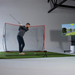 Golfer swinging into net with RSG Mobile starter bundle setup