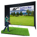 Golf simulator setup with a screen displaying a golf course and a person