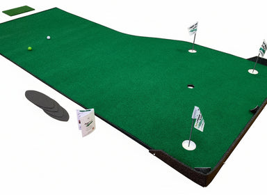 Green putting green mat with golf balls and flags on a wooden floor