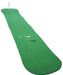 Green golf putting mat with a putter and balls on a white background