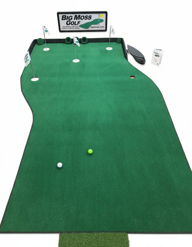 Green golf putting mat with golf balls on a wooden floor, featuring Big Moss Golf branding.